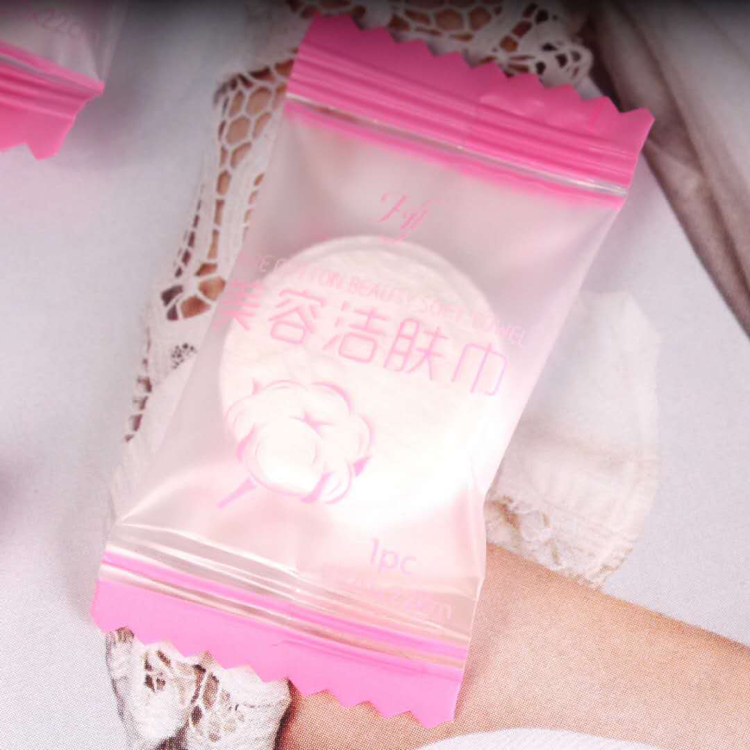 Disposable compressed towel individually wrapped candy cotton facial cleansing towel portable hotel travel compressed face towel