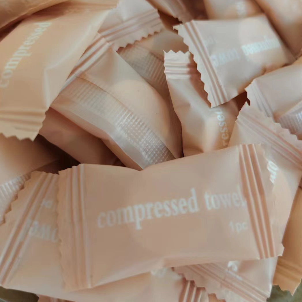 Disposable compressed towel individually wrapped candy cotton facial cleansing towel portable hotel travel compressed face towel