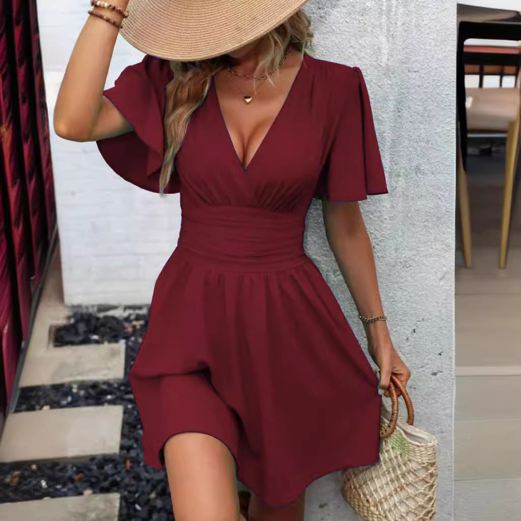 The new summer deep V-neck ruffled sleeve solid color wrap dress