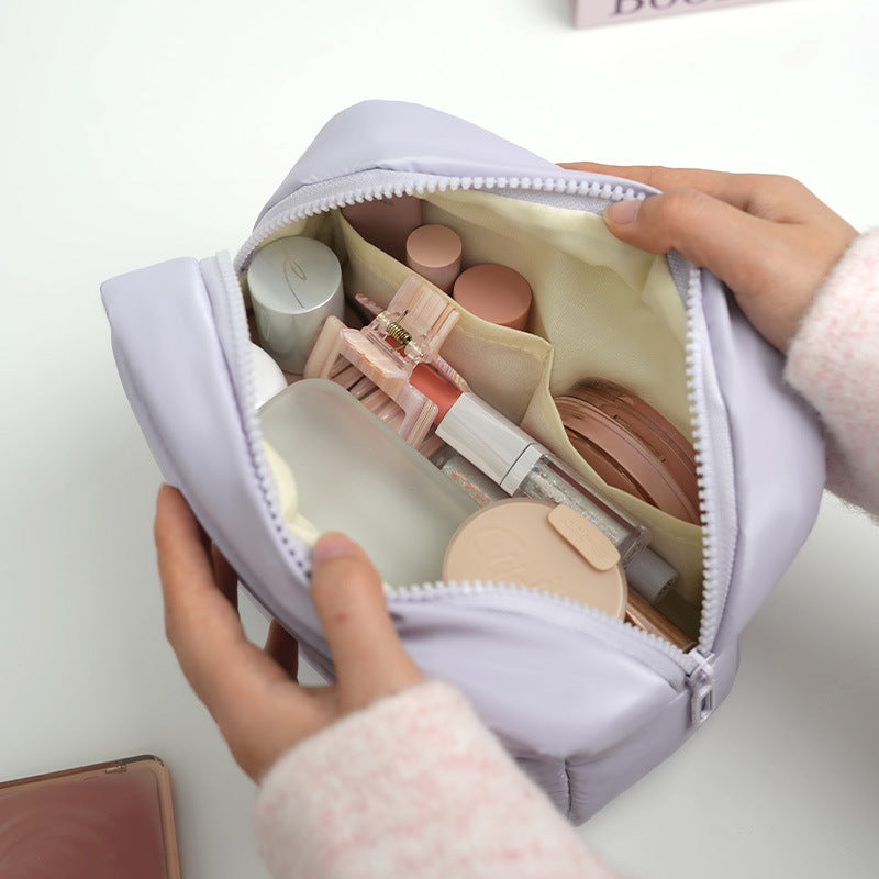 The new Xinghui portable storage bag, hand-held cosmetic bag, travel down storage bag, large-capacity high-value cosmetic bag
