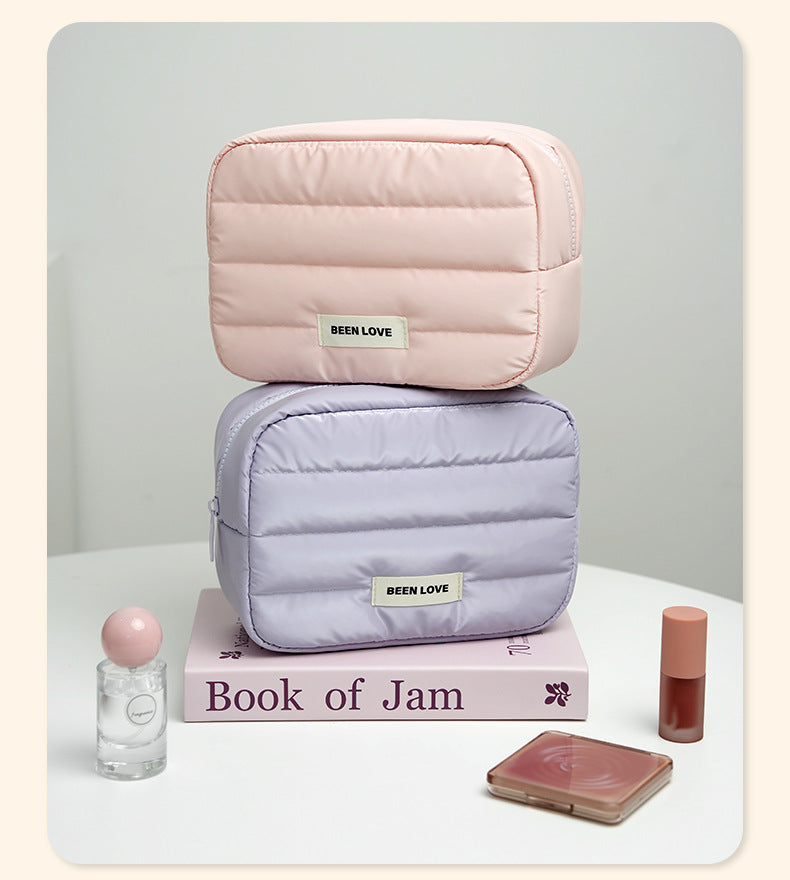 The new Xinghui portable storage bag, hand-held cosmetic bag, travel down storage bag, large-capacity high-value cosmetic bag
