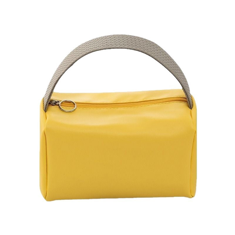 Cross-border PU solid color cosmetic bag, large-capacity waterproof toiletry bag, high-value travel outlet, hand-to-hand storage bag