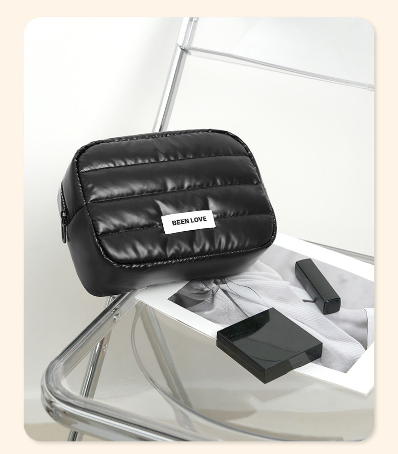The new Xinghui portable storage bag, hand-held cosmetic bag, travel down storage bag, large-capacity high-value cosmetic bag