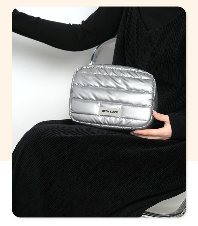 The new Xinghui portable storage bag, hand-held cosmetic bag, travel down storage bag, large-capacity high-value cosmetic bag