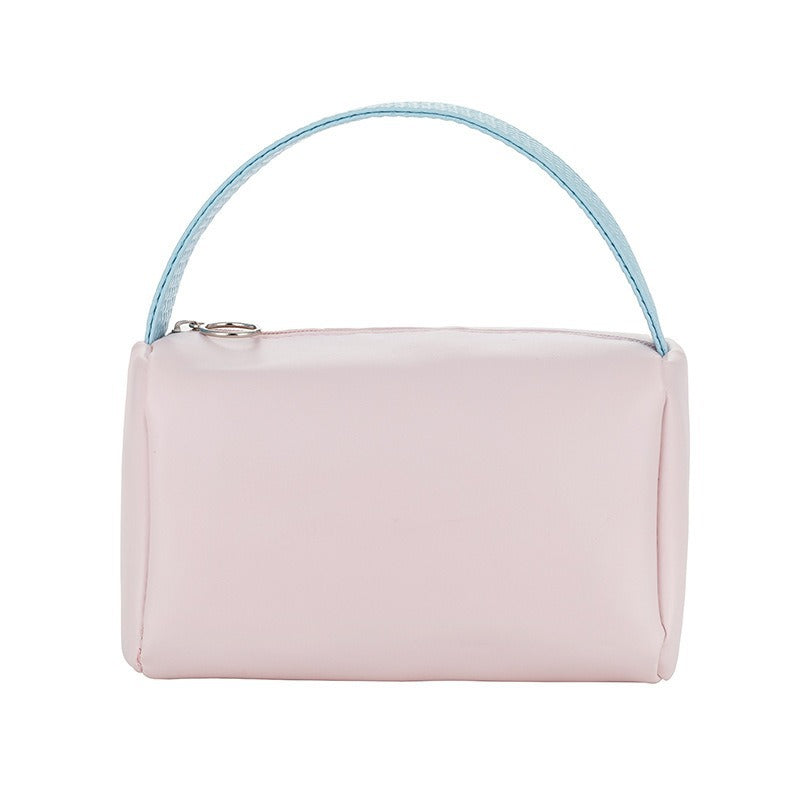Cross-border PU solid color cosmetic bag, large-capacity waterproof toiletry bag, high-value travel outlet, hand-to-hand storage bag