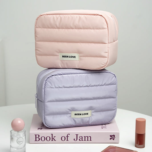 The new Xinghui portable storage bag, hand-held cosmetic bag, travel down storage bag, large-capacity high-value cosmetic bag