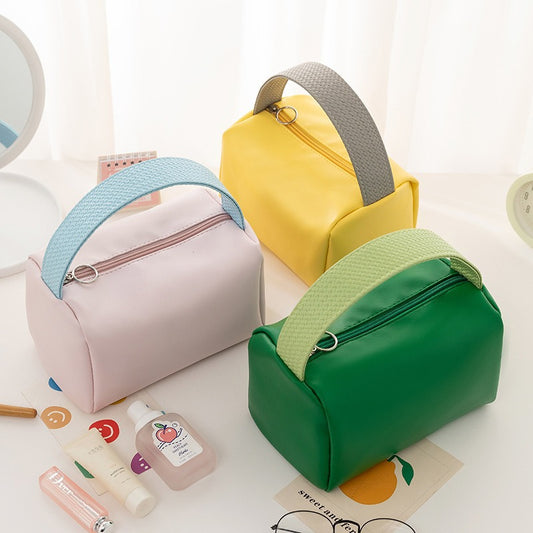 Cross-border PU solid color cosmetic bag, large-capacity waterproof toiletry bag, high-value travel outlet, hand-to-hand storage bag