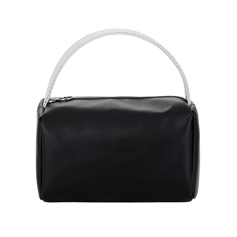 Cross-border PU solid color cosmetic bag, large-capacity waterproof toiletry bag, high-value travel outlet, hand-to-hand storage bag