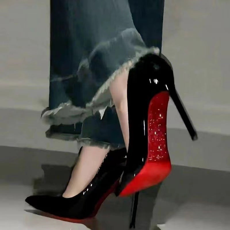 Side-hollow red bottom black high heels women's 2025 new sexy temperament nightclub stiletto heel pointed patent leather pumps